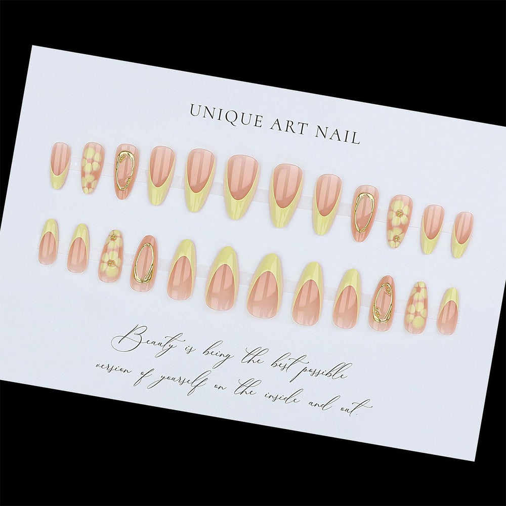 Toypoels hand applying a press-on nail demonstrating easy at-home use
