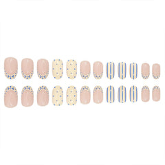 Toypoels hand model wearing the press-on nails illustrating instant polished manicure