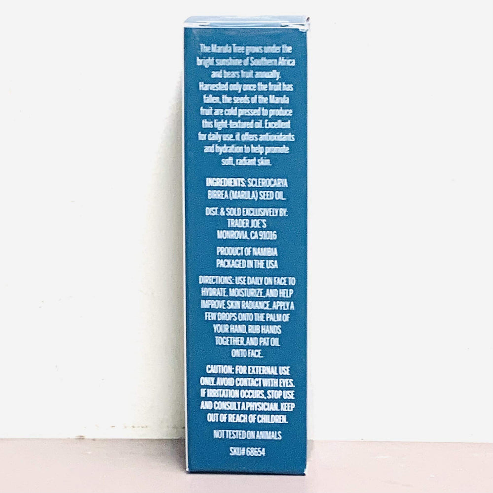 Trader Joe's marula oil dropper in hand demonstrating easy non-greasy application