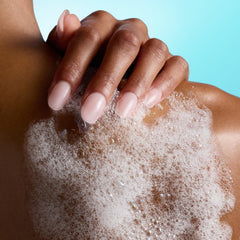 Tree Hut creamy foam on pouf demonstrating rich, luxurious cleanse