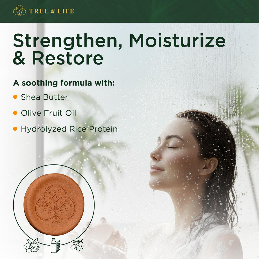 Tree of Life shampoo bar in shower lathering on hand to show easy use and frizz control