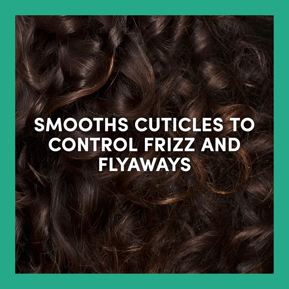 TRESemmé applied to damp curls improving detangling and defined bounce