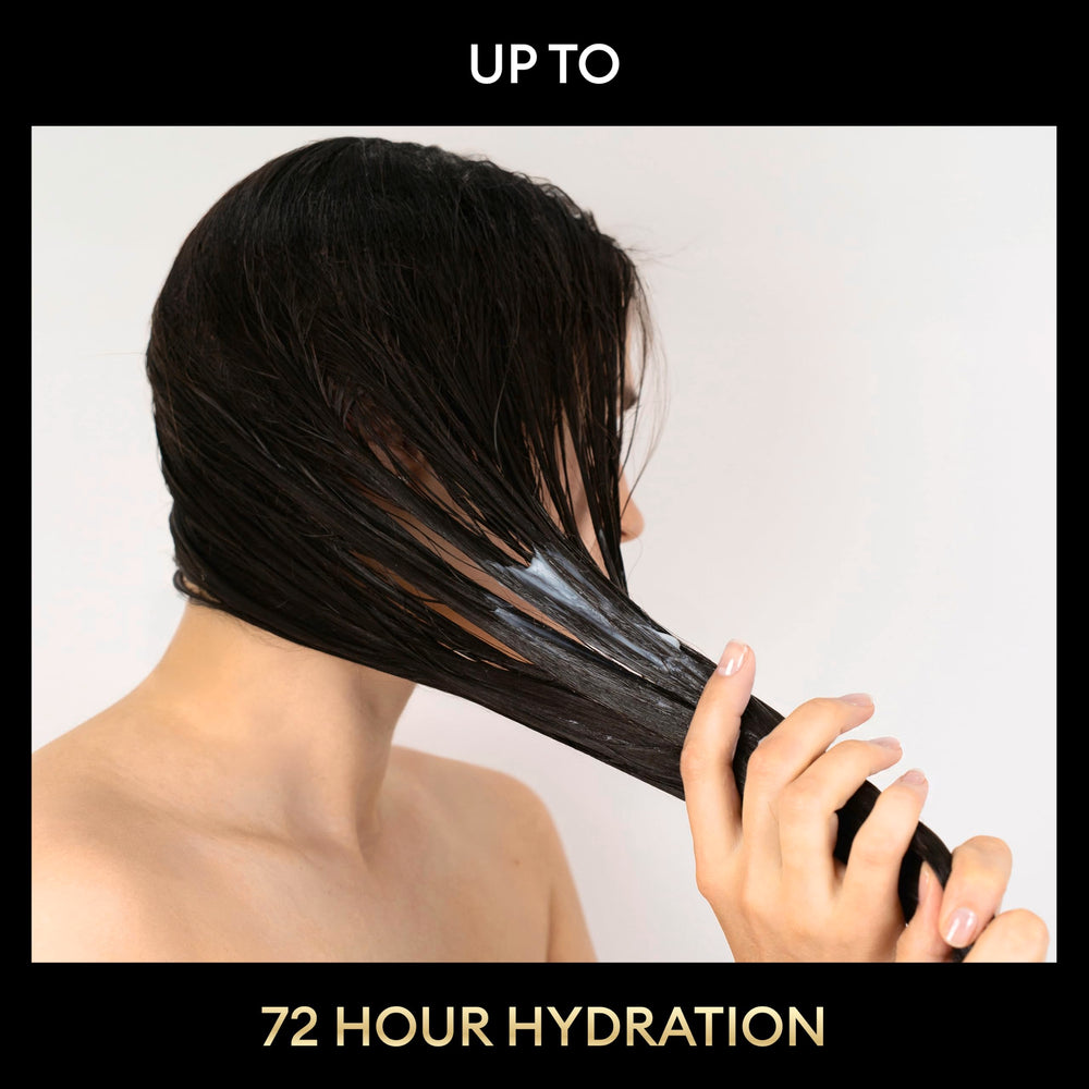 TRESemmé conditioner being applied to wet hair for smooth detangling benefit