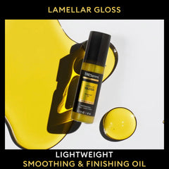 TRESemmé finishing oil smoothed on dry hair for sleek, polished shine