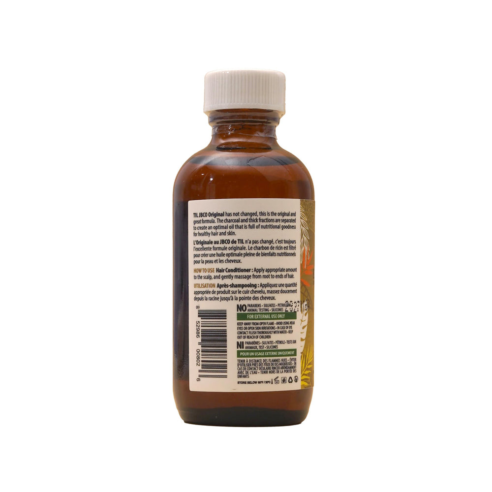 Tropic Isle Living 59ml next to coin showing compact travel-friendly benefit