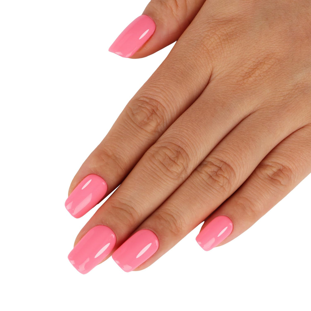 TUTUYU swatch on nails demonstrating true macaron coral-pink color