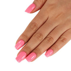 TUTUYU swatch on nails demonstrating true macaron coral-pink color