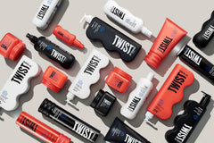 TWIST bottle staged with curly-haired model showing defined shiny curls