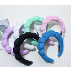 TYSSELY headband on hand to show size and comfortable portable fit