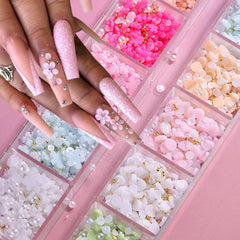 Tyuimhx flower charms applied on acrylic nail demonstrating professional-looking embellished tip