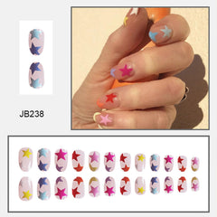 Tyuimhx close-up of five-pointed star design on acrylic nail, highlighting bright detail and polish-ready finish
