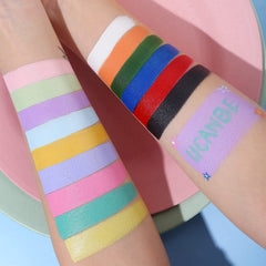 UCANBE applying paint on cheek to demonstrate precise application and color payoff
