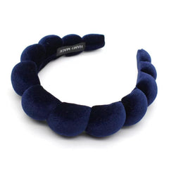 Uchyius navy blue headband front view showing sleek shape and polished look