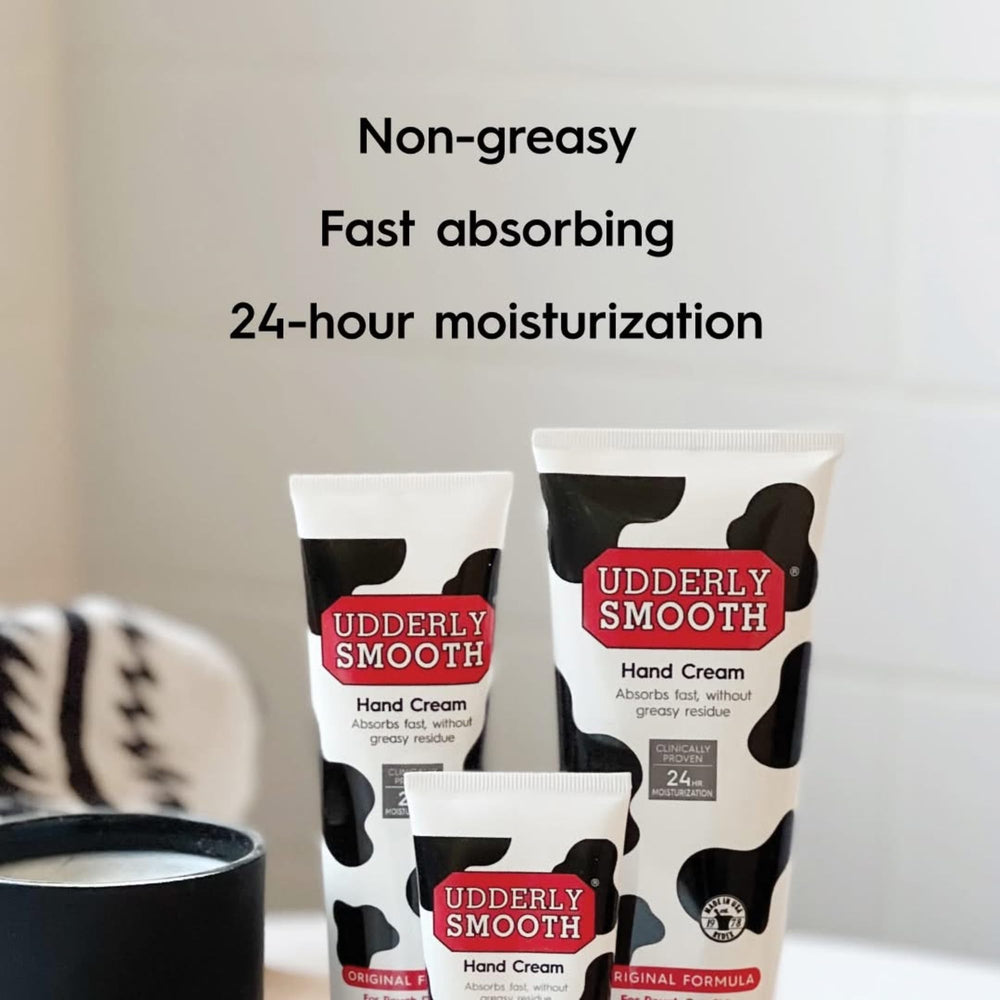 Udderly Smooth bundle held in hand illustrating travel-friendly size