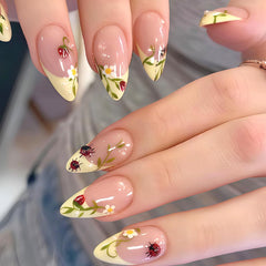 UEYRSEDB front packaging showing 24-piece yellow floral press-on nails and easy storage benefit