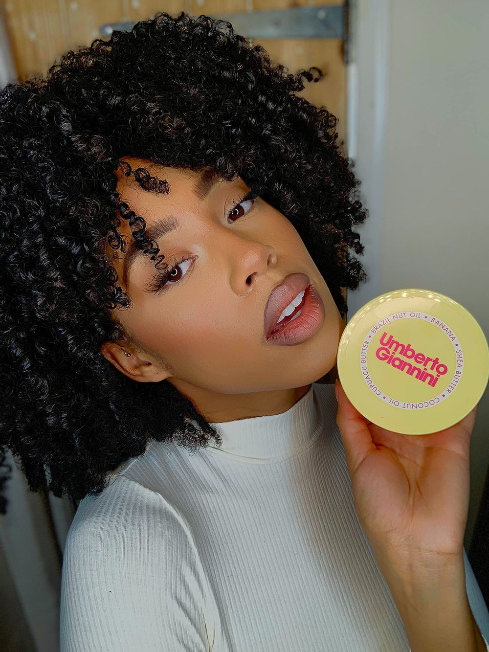 Umberto Giannini visible before and after curls showing improved definition