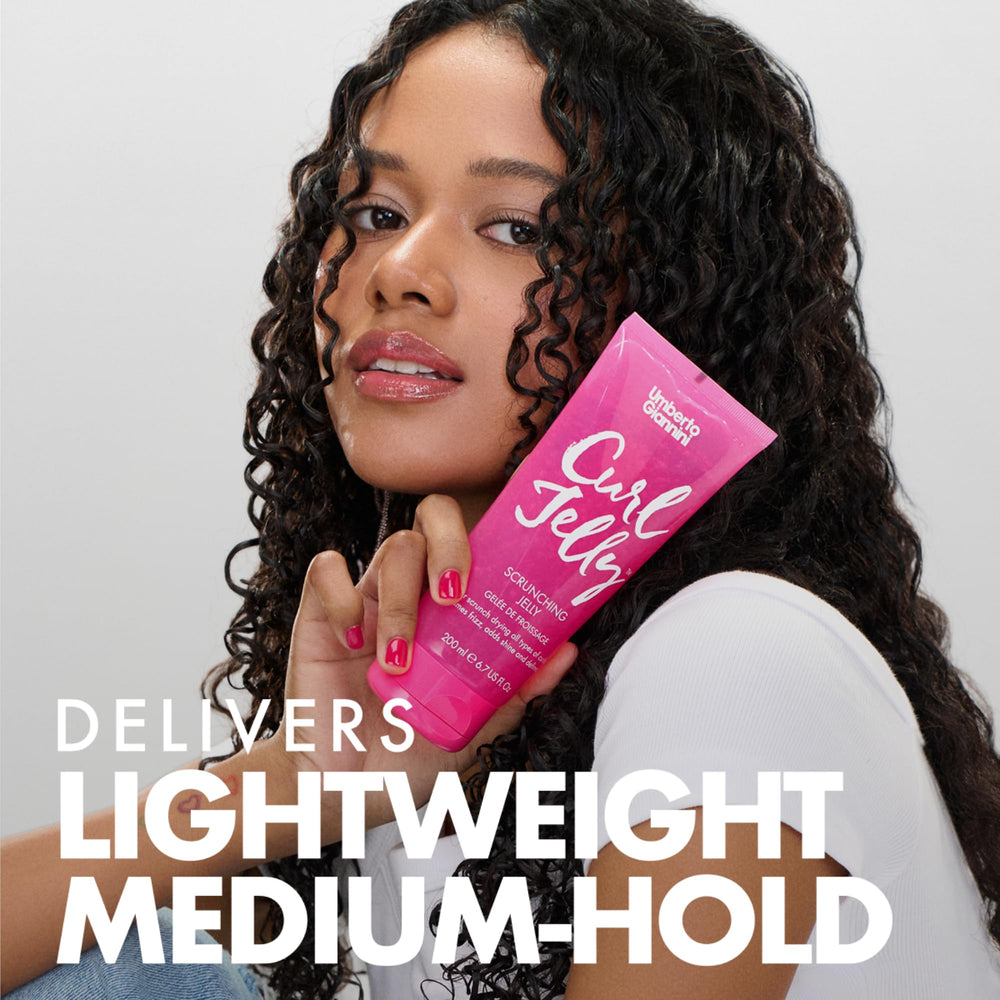 Umberto Giannini applying jelly to wet hair in shower to control frizz