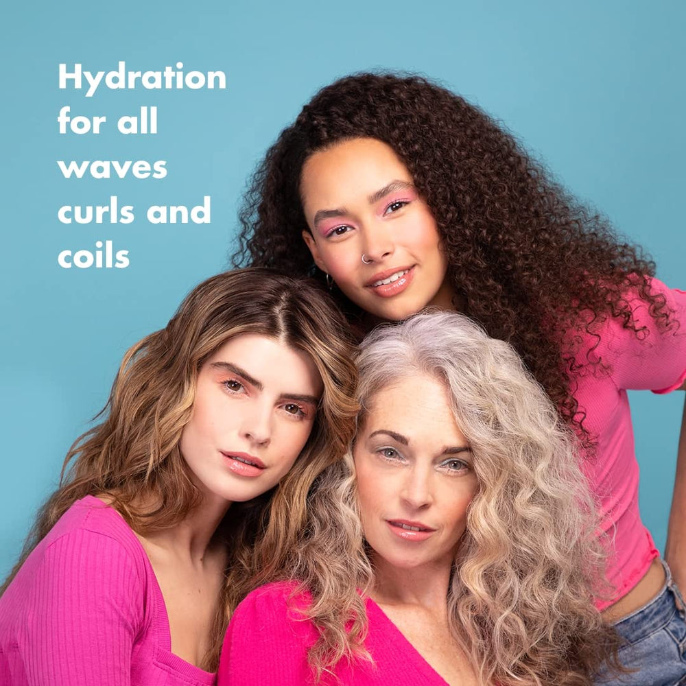 Umberto Giannini bottle in shower on wet curls, demonstrating gentle cleansing in use