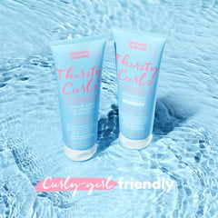 Umberto Giannini shampoo foaming in hand to show creamy lather and easy distribution