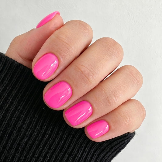 UNA GELLA front packaging showing neon hot pink nails and kit benefits