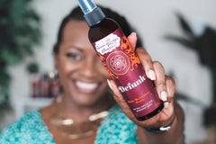 Uncle Funky's Daughter application on scalp illustrating targeted odor neutralizing