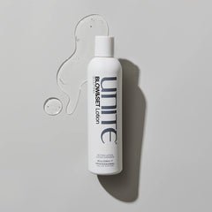 UNITE BLOW&SET bottle next to ruler showing the 8 fl oz size for reference