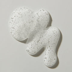 UNITE BLOW&SET lotion dispensed on hand showing lightweight texture and control