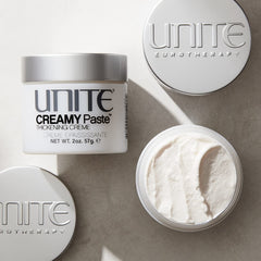 UNITE creamy paste texture closeup on fingertips demonstrating workable consistency and control