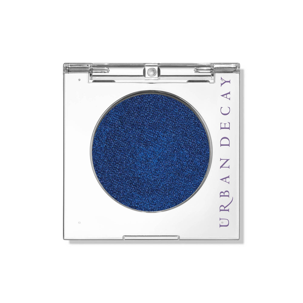 Urban Decay Charged front compact showing deep blue shimmer and sleek packaging benefit: easy storage