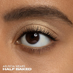 Urban Decay applied on eyelid showing luminous gold highlight and crease-resistant wear benefit