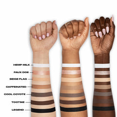 Urban Decay Legend label and ingredients highlighting hydrating oils and Vitamin E benefit