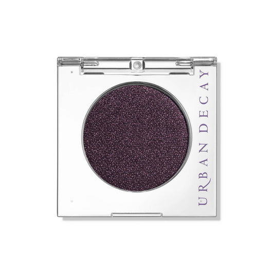 URBAN DECAY Ride front pan showing deep brown shimmer and purple shift benefit vivid pigment