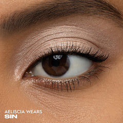 URBAN DECAY Sin close-up of pan texture revealing smooth, blendable finish benefit for seamless application