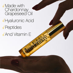 VACATION Chardonnay lip oil size scale next to credit card for travel-ready convenience