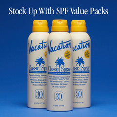 VACATION held in hand showing 6 fl oz scale for portability benefit