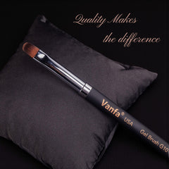 Vanfa brush beside coin showing size and travel-friendly portability