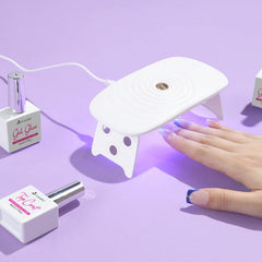 Vansiho nails on hand during application illustrating quick press-on process and neat result