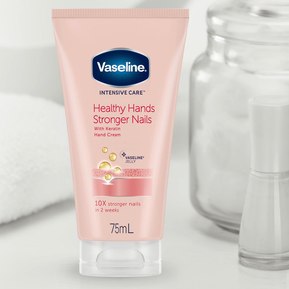 size comparison of Vaseline hand cream tubes beside a hand to show travel-friendly 3.4 oz