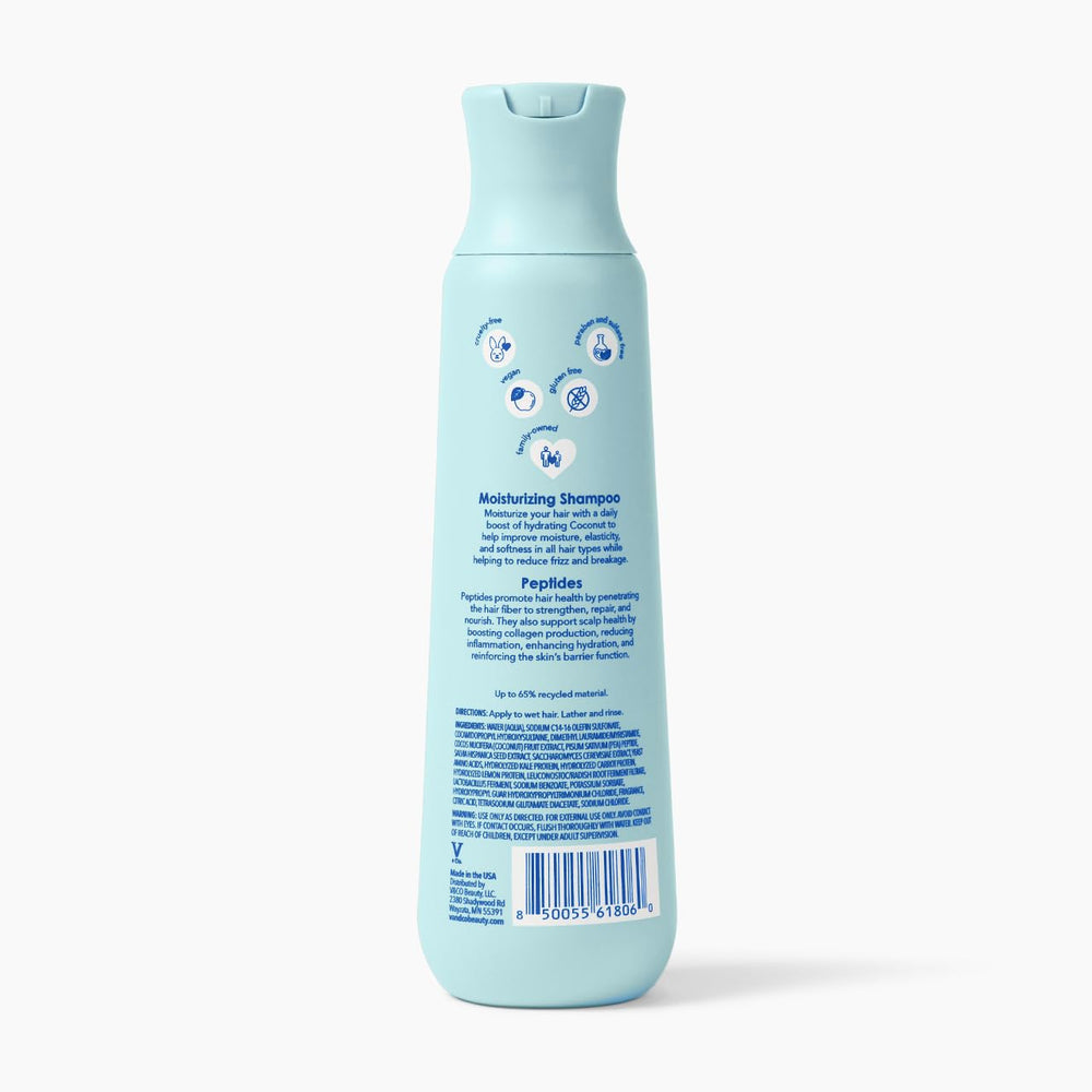 V&CO 12 oz bottle beside hand for size and travel-friendly scale