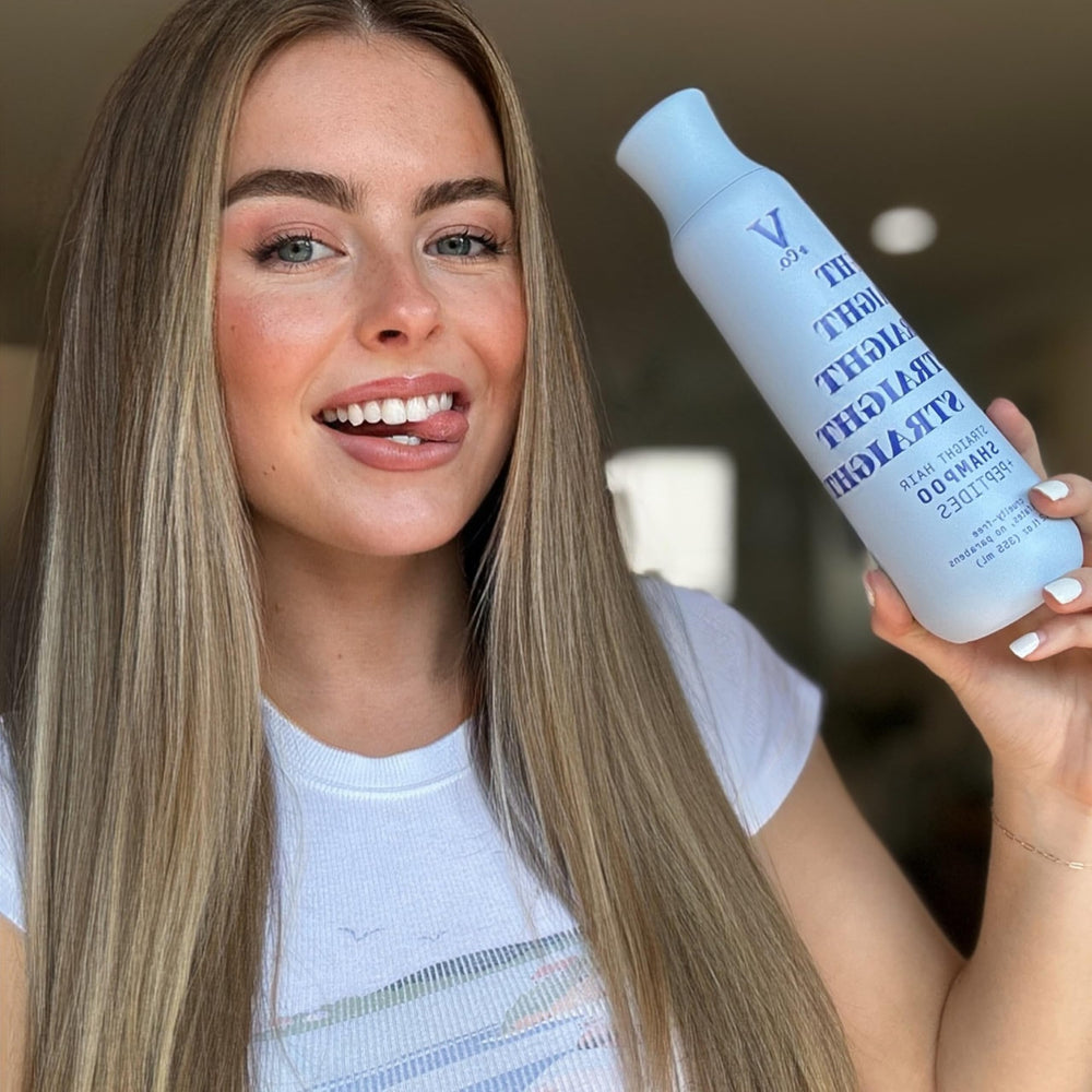V&Co. shampoo in shower being lathered for effective cleansing and frizz control