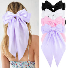 VELSCRUN front view of four-color oversized satin bows showing variety and gift-ready look