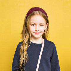 VELSCRUN model wearing headband illustrating everyday styling and comfort