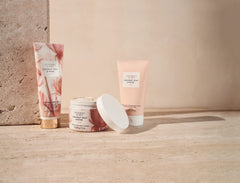 Victoria's Secret applying lotion to hand demonstrating quick absorption benefit