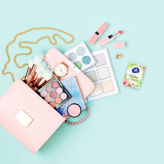 Vinda pack next to a coin demonstrating compact pocket size