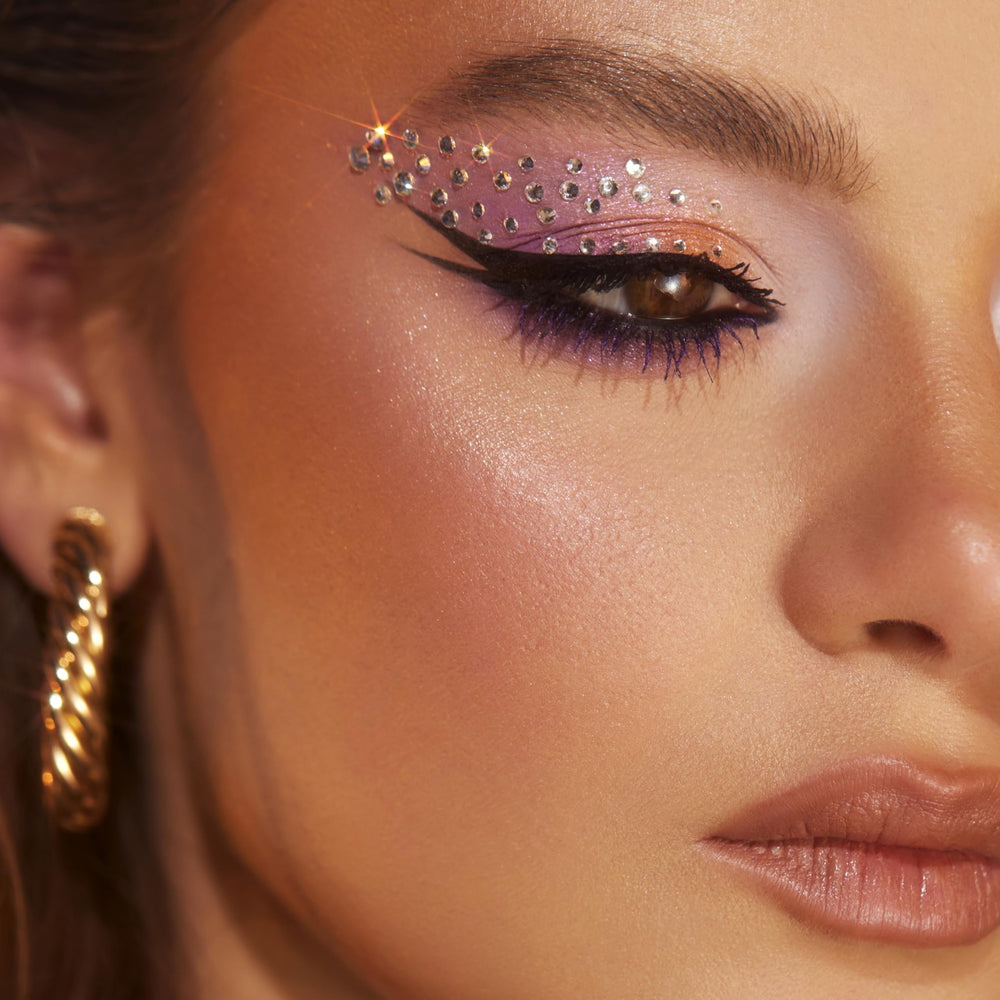 Vivienne Sabó on a vanity with makeup tools showing everyday use benefit