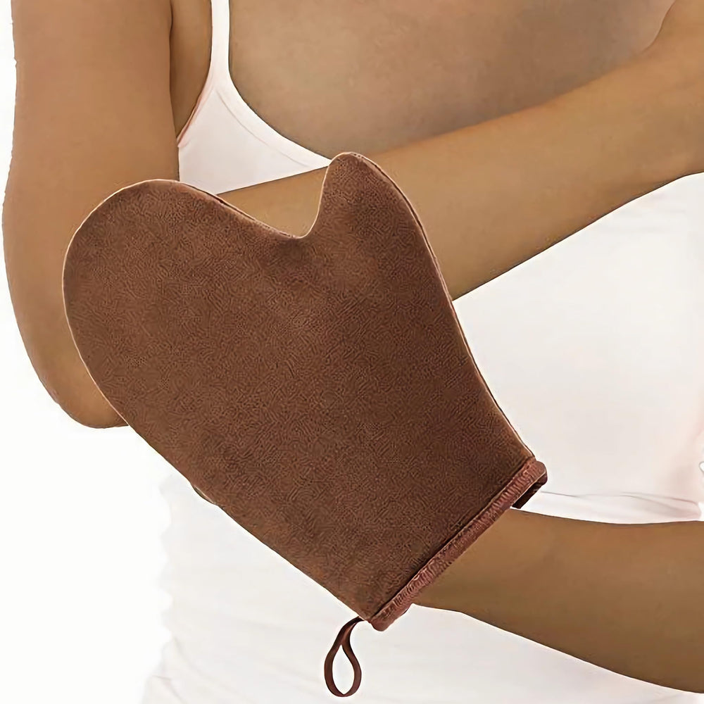 VNIHTT mitt in use on leg demonstrating even tan coverage