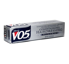 VO5 applied to hair ends smoothing frizz and improving shine