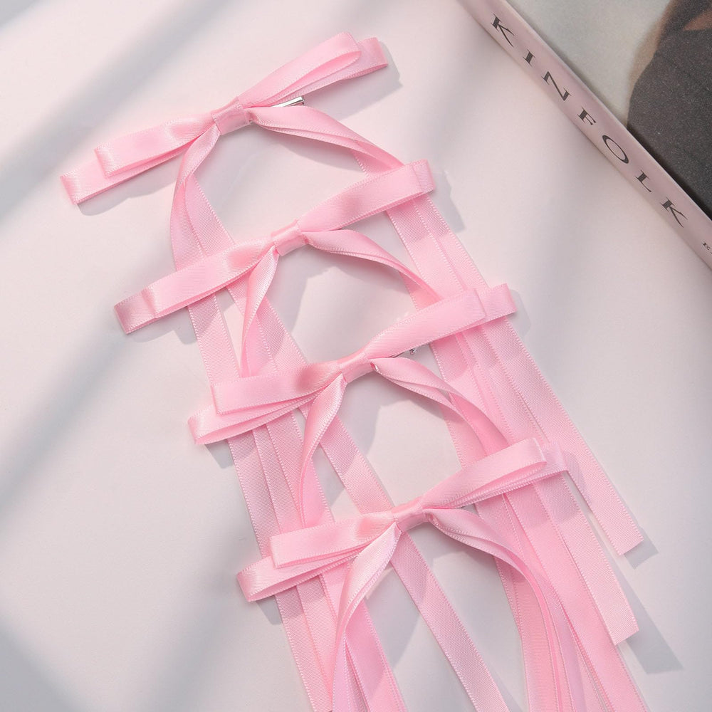 VOBOBE bow next to ruler showing 4.5 inch length for size clarity
