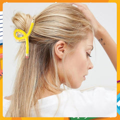 Vovii pencil clip in hair securing an effortless updo look