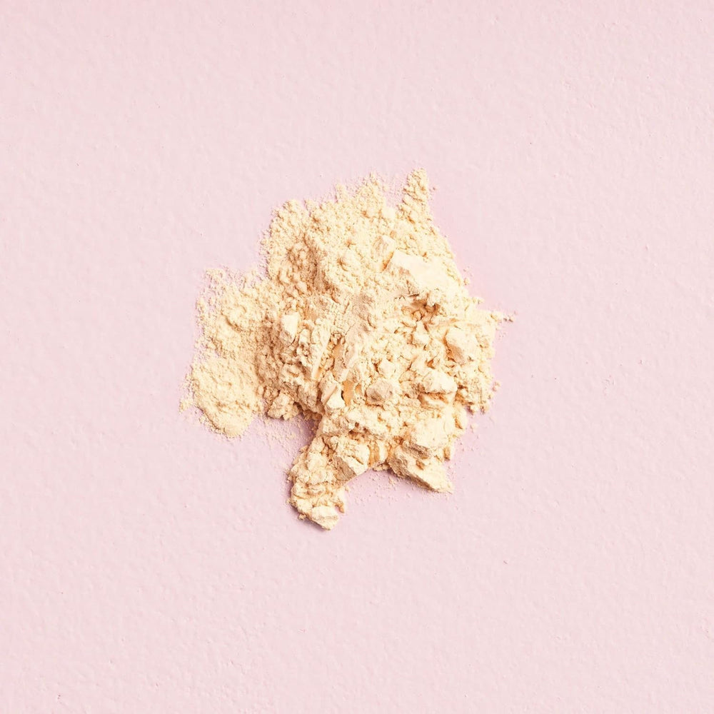 W7 powder pot held in hand showing compact size and travel convenience